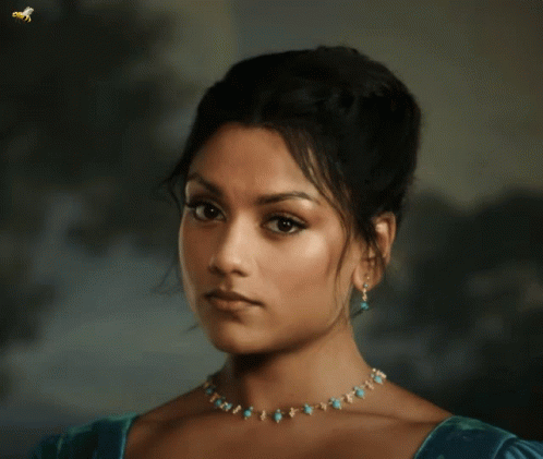 Woman With Necklace and Earrings and Bee