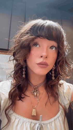 Woman With Necklace and Earrings Looking Up
