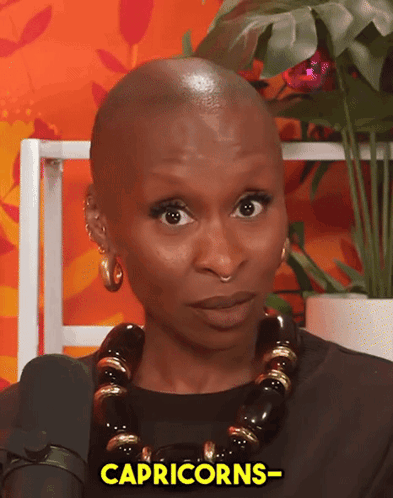 Woman With Necklace And Earrings Saying Capricorns GIF