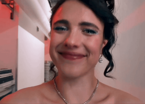 Woman with Necklace and Earrings Smiling