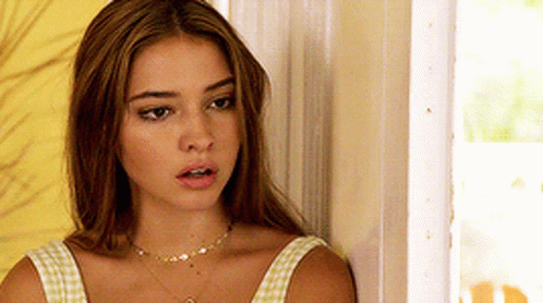 Woman With Necklace Beside Door GIF