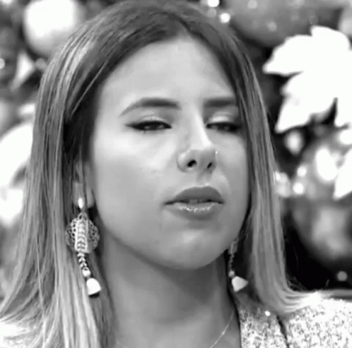 Woman With Nose Ring And Earrings Looking GIF