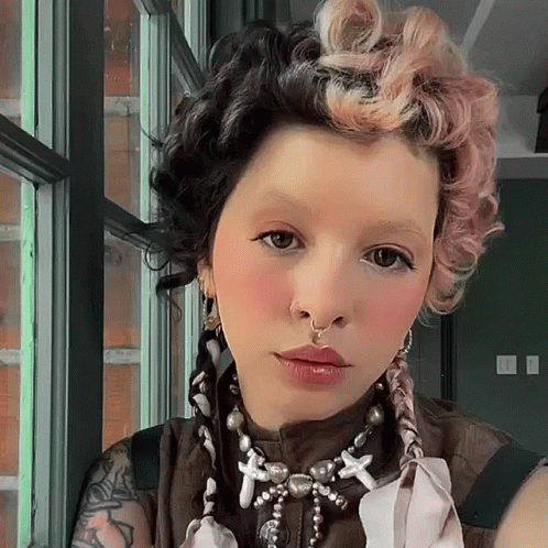 Woman With Nose Ring and Necklace With Crosses