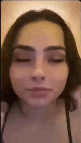 Woman With Nose Ring Making Face Eyes Closed