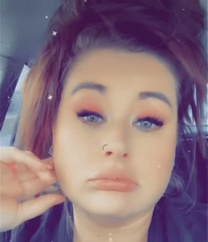 Woman With Nose Ring Making Funny Face In Back Seat GIF