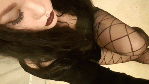 Woman With Nose Ring, Red Lipstick, Fishnets GIF