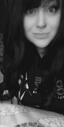 Woman With Nose Ring Smiling in Reebok Shirt