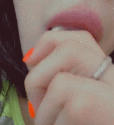 Woman With Orange Nail Polish Eating Popsicle GIF