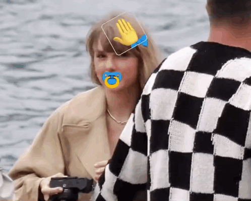 Woman With Pacifier Beside Man in Checkered Sweater