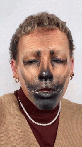Woman With Pearl Necklace And Earrings Eyes Closed GIF