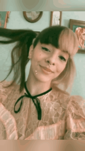 Woman With Pigtails and Nose Ring Smiling