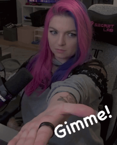 Woman with Pink and Purple Hair Pointing