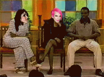 Woman With Pink Hair Between Two Men