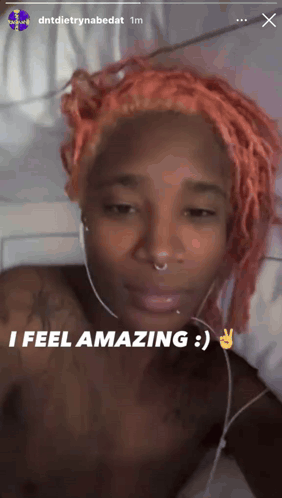 Woman With Pink Hair Headphones Saying I Feel Amazing GIF