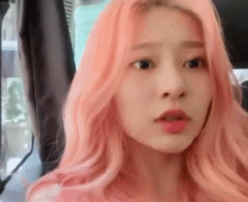 Woman With Pink Hair In Back Seat Of Car GIF
