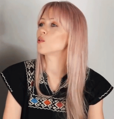 Woman With Pink Hair in Black Shirt With Pattern