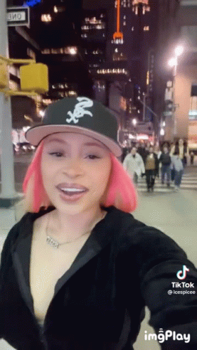 Woman With Pink Hair Taking Selfie