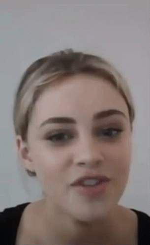 Woman With Ponytail And Black Shirt GIF