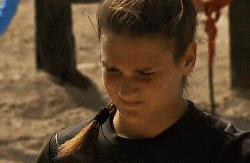 Woman With Ponytail and Black Shirt on Sand