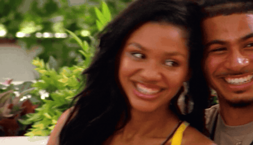 Woman With Ponytail By Yellow And Orange Wall GIF