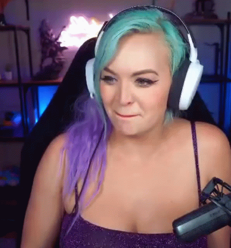 Woman with Purple and Green Hair Wearing Headphones and Microphone