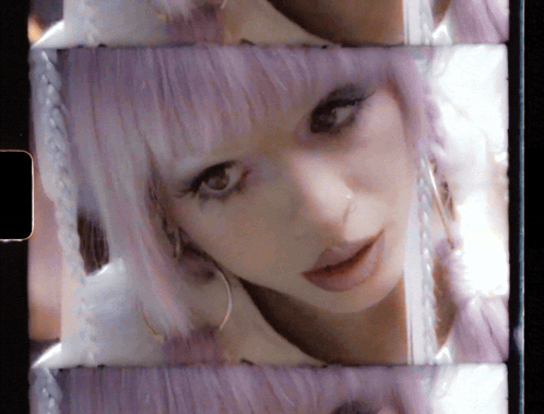 Woman With Purple Hair and Earrings