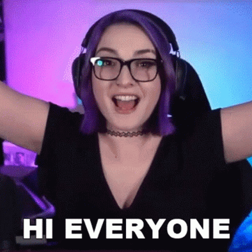 Woman With Purple Hair And Glasses Wearing Headphones Says Hi Everyone GIF