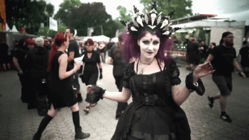 Woman With Purple Hair in Black Dress and Crown