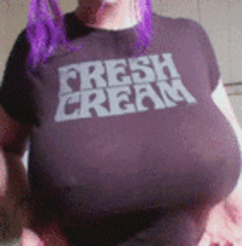 Woman with Purple Hair in Purple Shirt Saying Fresh Cream