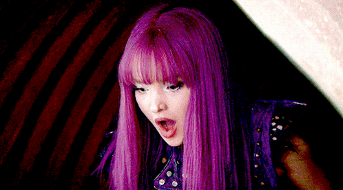 Woman With Purple Hair Making Funny Face GIF