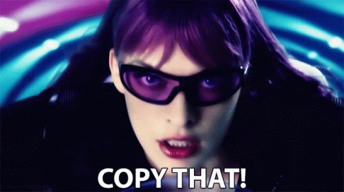 Woman with Purple Hair Wearing Sunglasses Saying Copy That