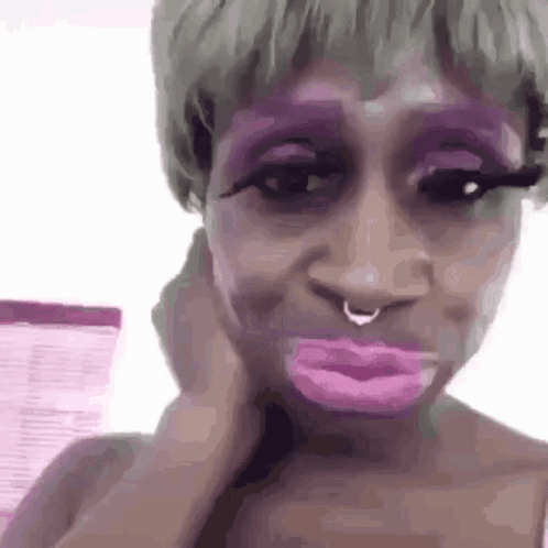 Woman With Purple Makeup Making Funny Face