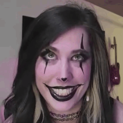 Woman with Purple Makeup Making Funny Face