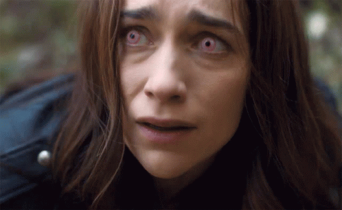 Woman With Red Eyes Looking at Camera