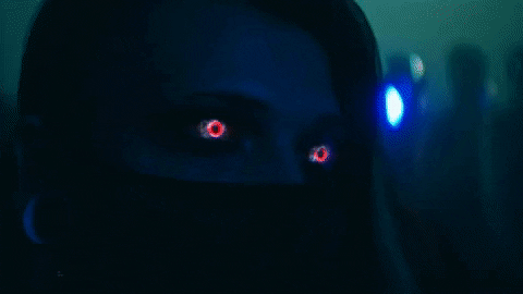 Woman With Red Eyes Wearing Face Mask GIF