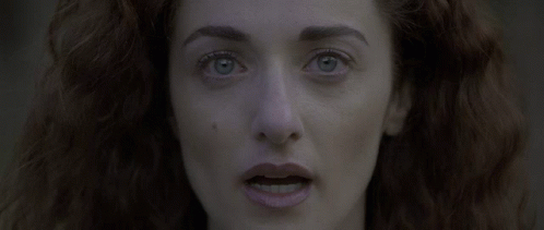 Woman With Red Hair and Blue Eyes Close Up