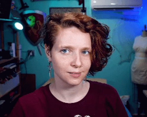 Woman with Red Hair and Blue Eyes in Burgundy Shirt