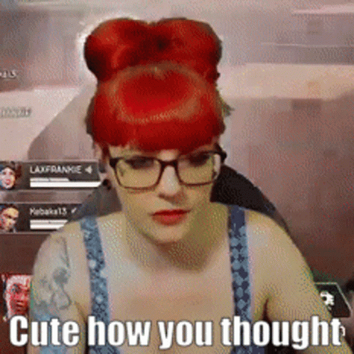 Woman with Red Hair and Glasses Saying Cute