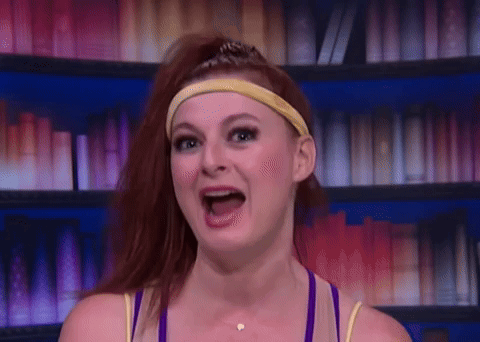 Woman With Red Hair And Headband Smiling GIF