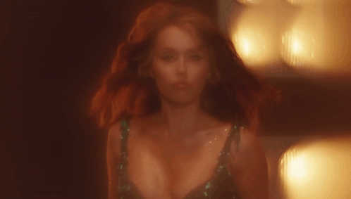 Woman With Red Hair and Plunging Neckline