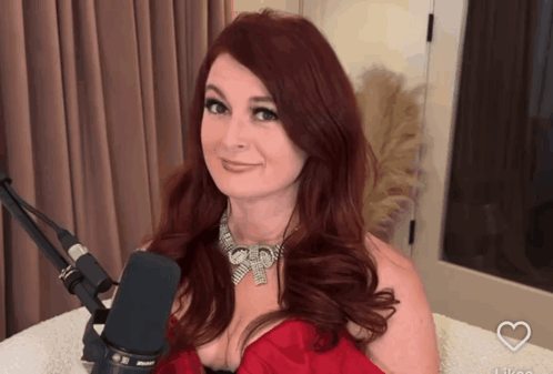 Woman With Red Hair At Microphone With Heart GIF