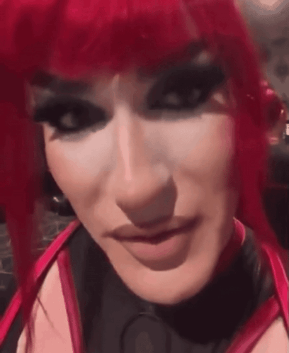 Woman With Red Hair Black Makeup Close Up GIF