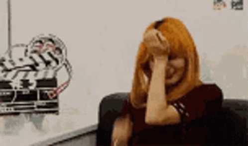 Woman with Red Hair Covering Face