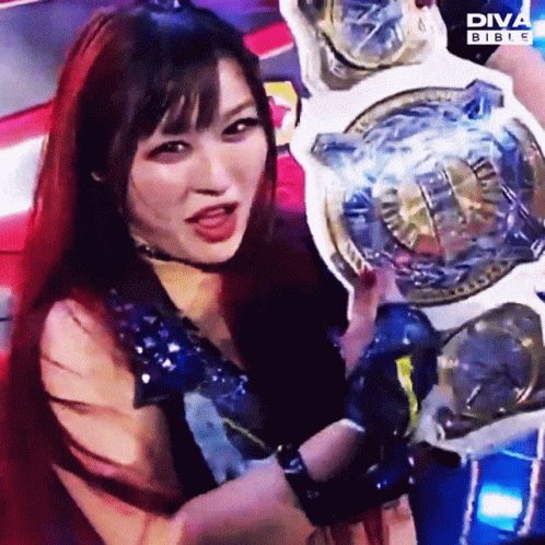 Woman with Red Hair Holding Diva Bible Championship Belt