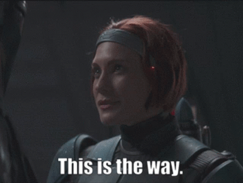 Woman With Red Hair Holding Gun GIF