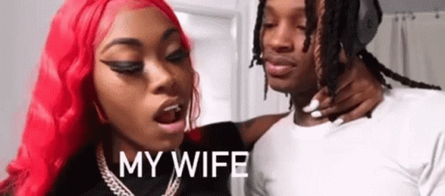 Woman With Red Hair Holding Man Neck GIF