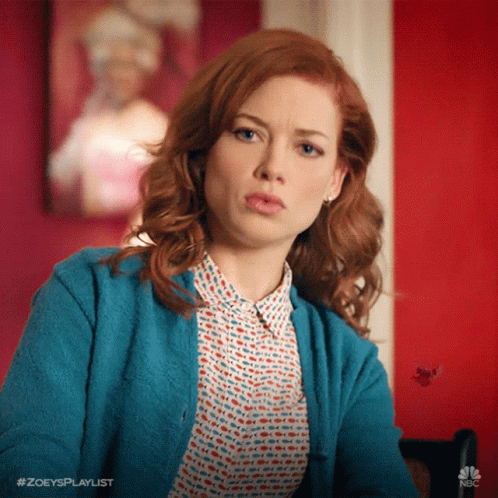 Woman With Red Hair In Blue Cardigan GIF