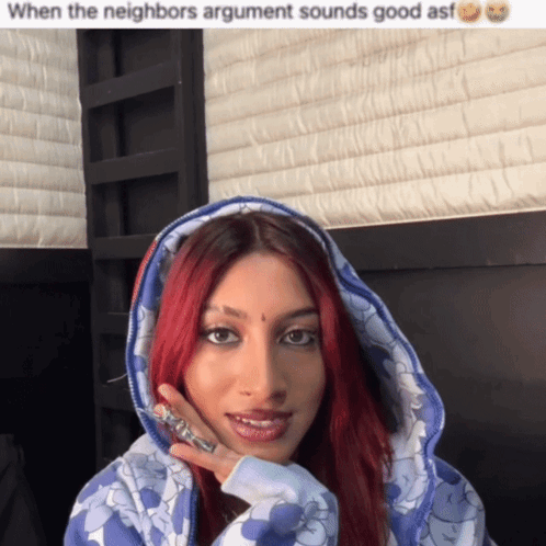 Woman with Red Hair in Blue Hoodie
