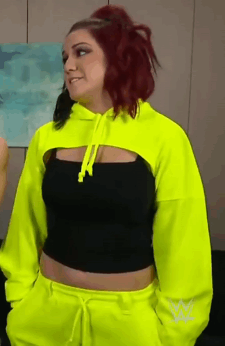 Woman With Red Hair in Neon Yellow Hoodie