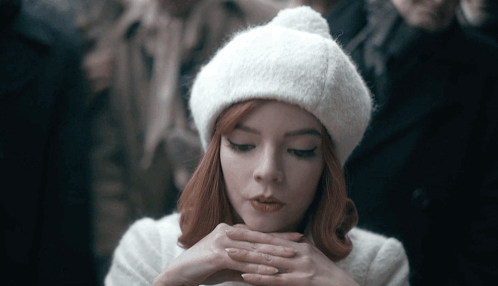 Woman With Red Hair in White Hat and Coat